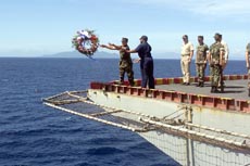 Sailors Place Wreath near Savo Island.